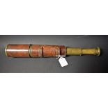 A World War One four-drawer lacquered brass and brown leather field telescope,