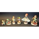 Goebel Hummel figures, including Singing Lesson, Little Gardener, Apple Tree Boy,