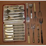 A collection of ten 19th century bread forks; a set of six silver hafted knives;