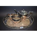 An EPNS three piece boat shape half fluted tea service,