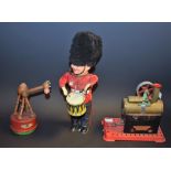 A late 1950's German clockwork drummer boy; a mid 20th century Triang camel;