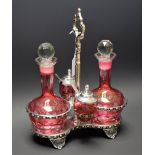 A Cranberry overlay etched four piece cruet,