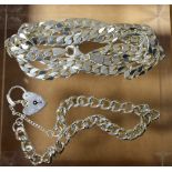 A silver flattened curb link necklace; a silver bracelet, heart shaped,