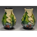 A pair of Moorcroft contemporary Holly and Ivy pattern vases,. 10.