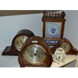 An oak mantel clock with ceramic dial,