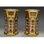 A pair of Royal Crown Derby 1128 pattern hexagonal vases, all gold border, 11.