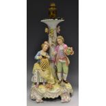 A German figural table lamp, of a couple,