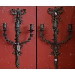 A pair of bronzed wall lights, three arm, as three branches, foliate,