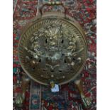 A 19th century brass armorial barrel coal scuttle,