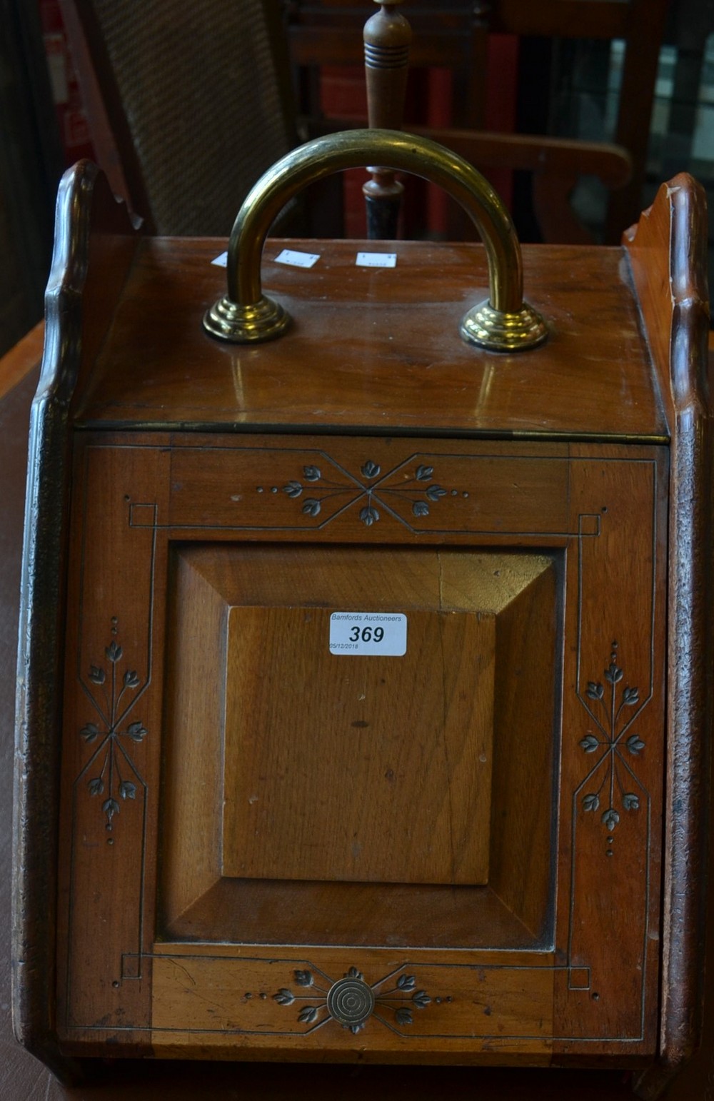 An early 20th century coal scuttle