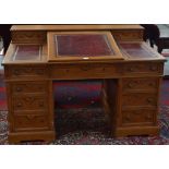 A Victorian oak Dickens desk,