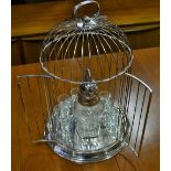 A polished metal circular form bird cage, together with novelty parrot decanter,