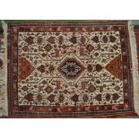 Carpets - a Persian style woollen rug, in shades of brown, blue, green and white, with birds,