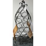 A wicker and wrought iron shaped wine rack,