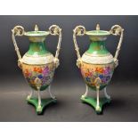 A pair of Sevres type lidded vases, floral panel, emerald green bands, mask head handles,