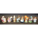 Beswick Beatrix Potter ceramic models, including Little Pig Robinson Spying, Goody Tiptoes,