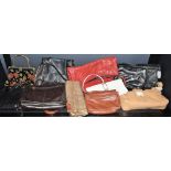 A quantity of leather handbags, mostly new and unused, (approx.