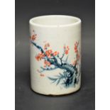 A Chinese ceramic brush pot, prunus decoration,