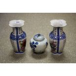 A pair of Chinese export ware quatrelobed vases, printed and painted with script and foliage,