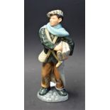 A Royal Doulton ceramic figure, Newsboy,