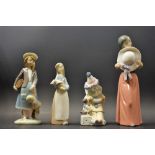 A Lladro figure, School Girl; others, Clown, Girl with Puppy,