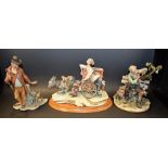 A musical Capodimonte type figure group, Guiseppe with donkey pulling a musical wagon,