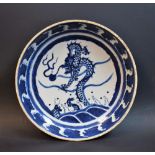 An Oriental blue and white dish, with dragon chasing pearl, approx 28.