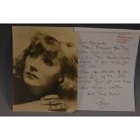 Greta Garbo - a signed sepia tone portrait photograph, 15cm x 20cm,