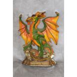 Dragon cast metal painted doorstop. 27cm high 22cm wide.