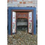 Cast Iron fire insert with floral and & urn tiles inset.