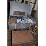 Tin trunk with quantity of cast iron gutter hoppers and Victorian drain covers along with a wood and