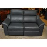 Two Granfort leather sofas with motors for reclining. PAT tested