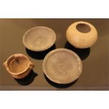 A group of Chinese earthenware objects, to include a small brown twin-handled jar, a pair of
