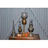 Three oil lamps