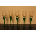 Five hock glasses with green twist stems