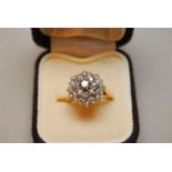 An 18 Carat Gold Diamond target design ring - total approx 0.8 Carat. Weight 3.7 g. Size 'K'