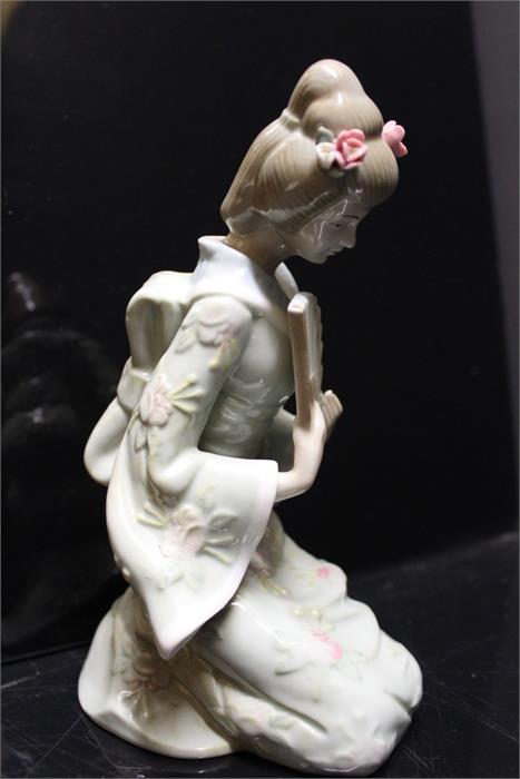 An unmarked oriental style porcelain figurine.