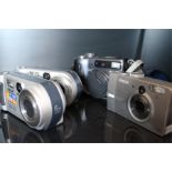 An Epson L-400, two sony 3.2 megapixel cybershot and a sony 4.3 megapixel cybershot