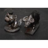 Two carved black stone animals - a buffalo, a pair of birds