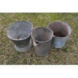 Three galvanized buckets.