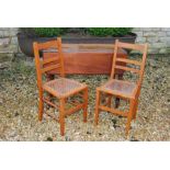 Two caned seat chairs and a pembroke table (for restoration)