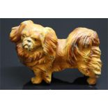 A cold painted metal pekingese dog