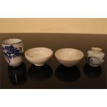A group of Chinese ceramic objects, to include 2 glazed bowls, one tall, cylindrical porcelain cup