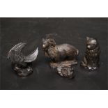 Four black stone animal figures - a rook, sheep, cat , bird.