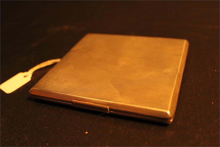 A Silver cigarette case - Birmingham - William Base and sons, machine decoration with GFK