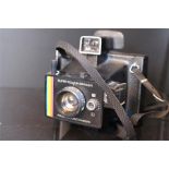A polaroid Supercolour swinger camera