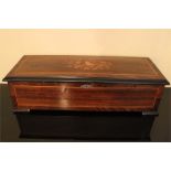 A late 19th century rosewood, kingwood? and ebony swiss musical box with twelve airs inlaid with