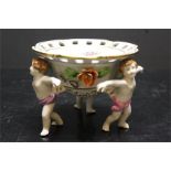 Bowl on three cherub putti supports - marked foreign 1817 with laurel shield