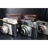 Three ILford cameras, a sportsman - vario lens (no case) , a sportsman prontor 125 lens - cased &
