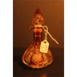 A Bohemian amber & Clear glass perfume bottle & stopper faceted and etched with floral decoration.